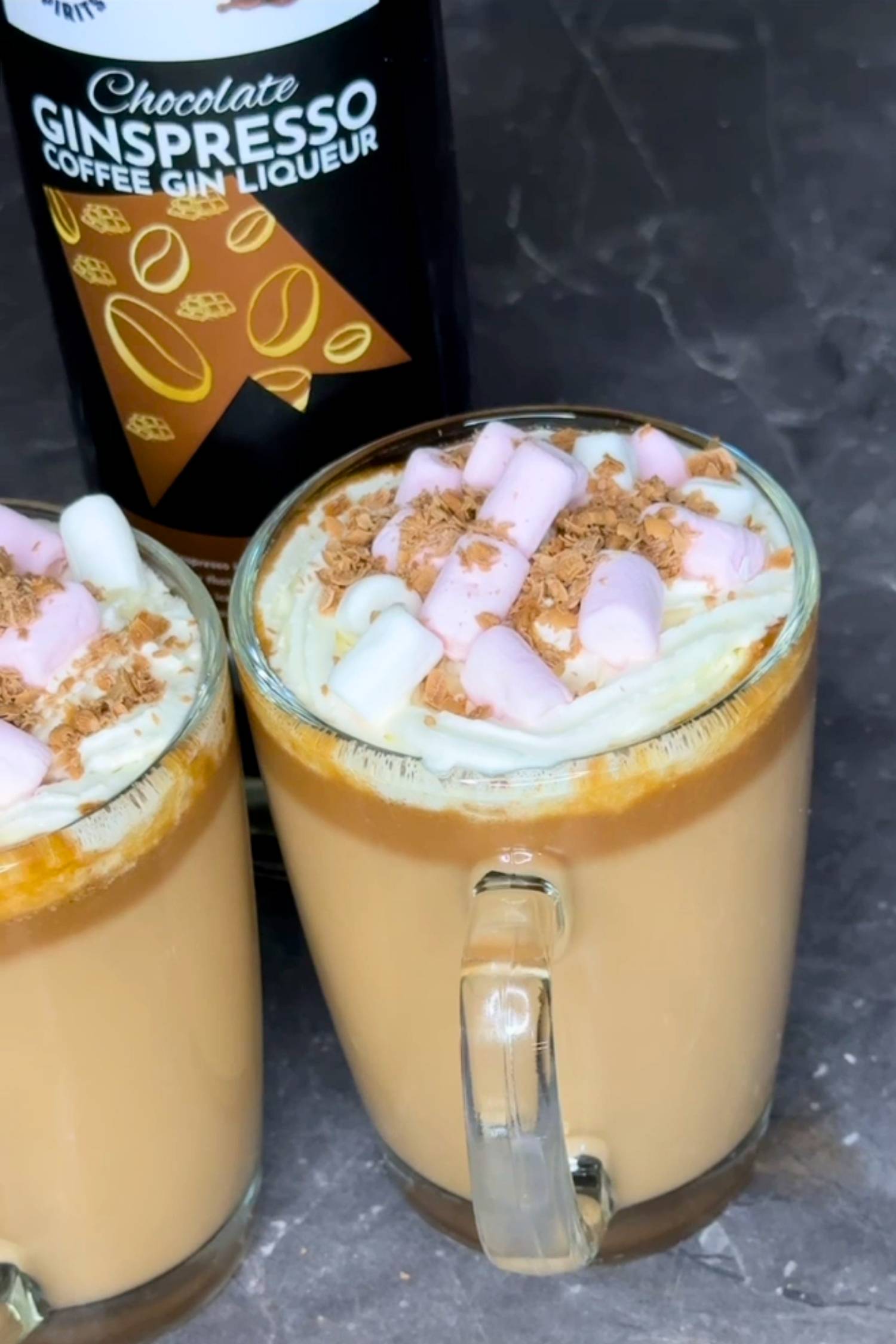 Two glasses of spiked hot chocolate made with Chocolate Ginspresso coffee gin liqueur.