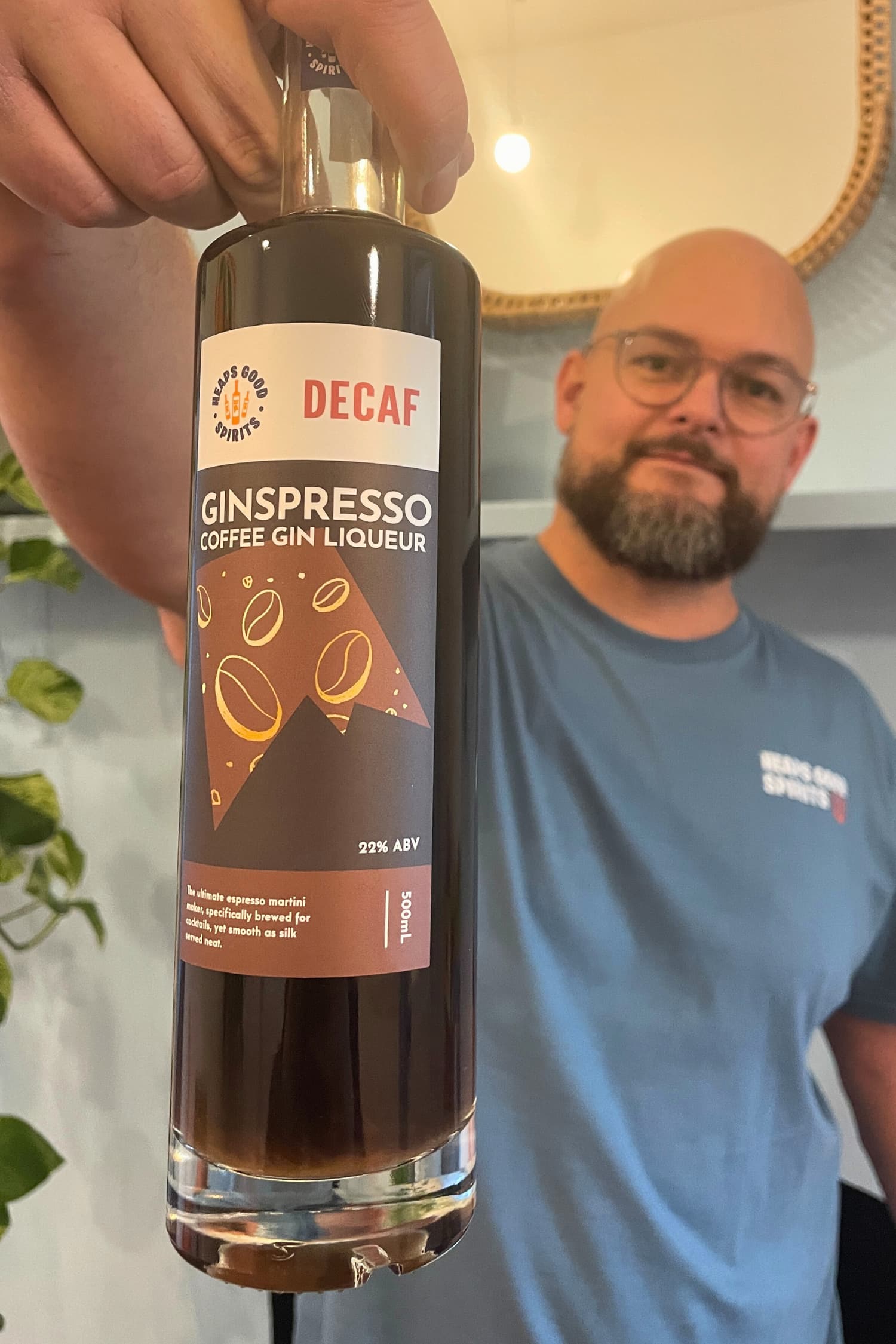 Founder holding Decaf Ginspresso coffee gin liqueur bottle