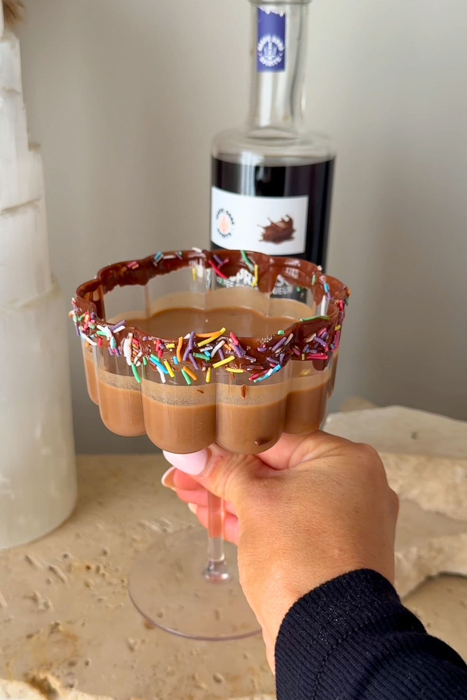 Chocolate Ginspresso chocolate martini with sprinkles and chocolate rim for Easter cocktail ideas.