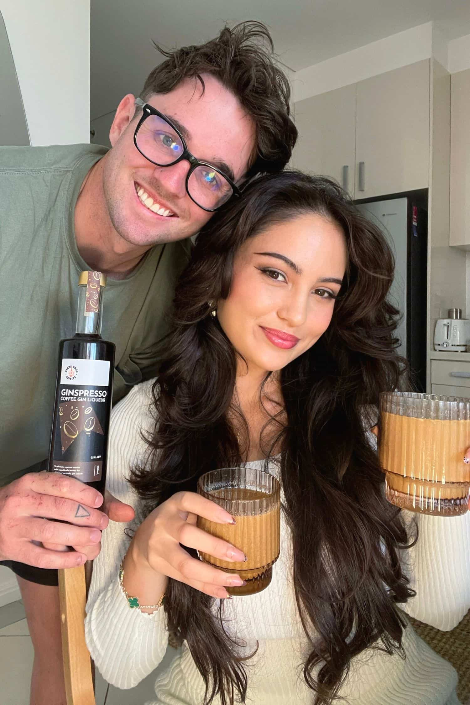 Couple holding Ginspresso coffee gin liqueur and espresso martini cocktails at home