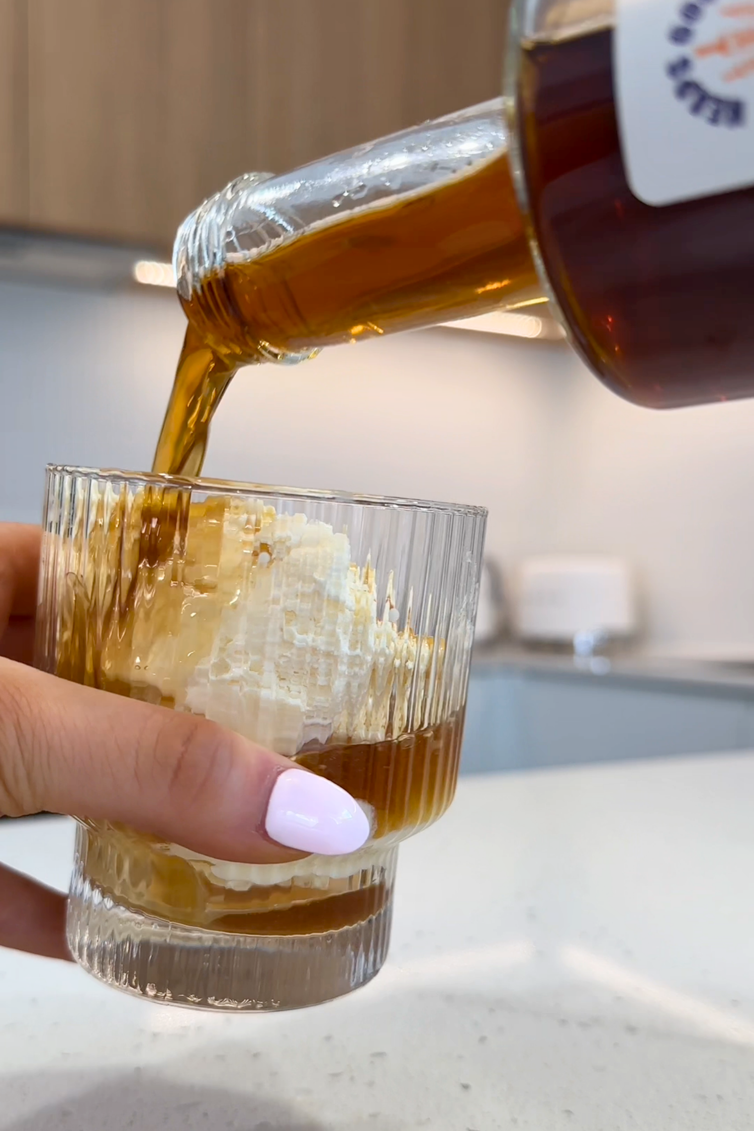 Salted Caramel Ginspresso being poured over ice cream in a glass