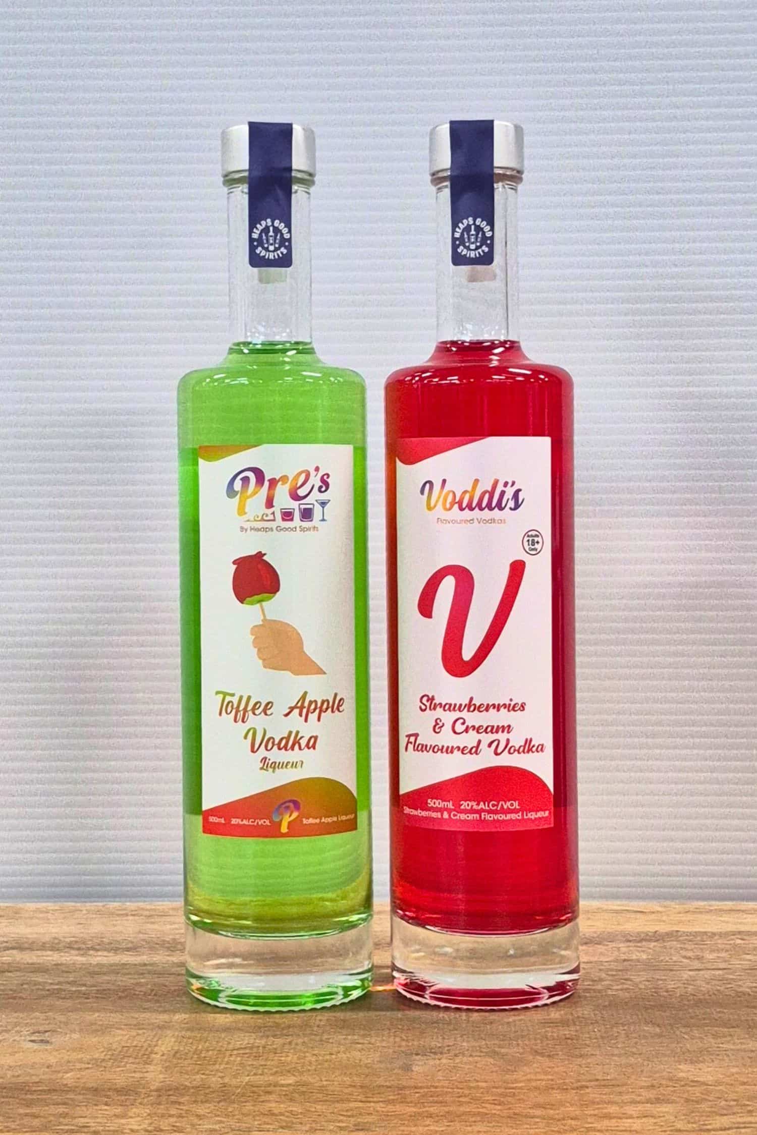 Voddi’s Toffee Apple and Strawberries & Cream flavoured vodka bottles side by side