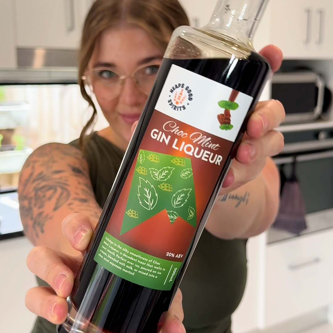 Bottle of Choc Mint Gin Liqueur held up by a customer.