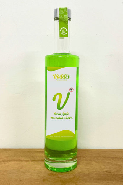 Voddi’s Green Apple Flavoured Vodka 500ml bottle on wooden surface against white background