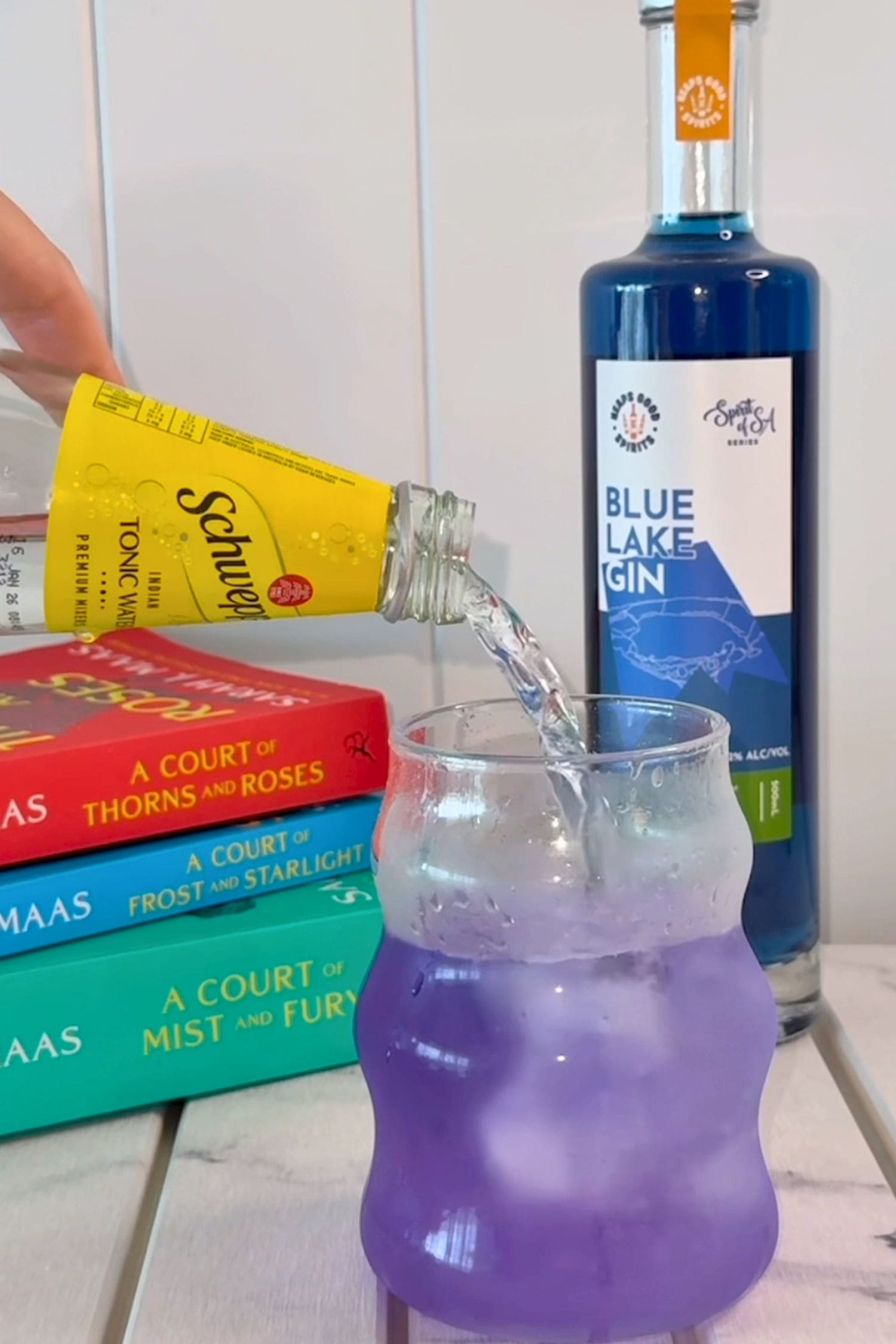 Blue Lake Gin and tonic transforming from blue to purple as tonic water is poured.