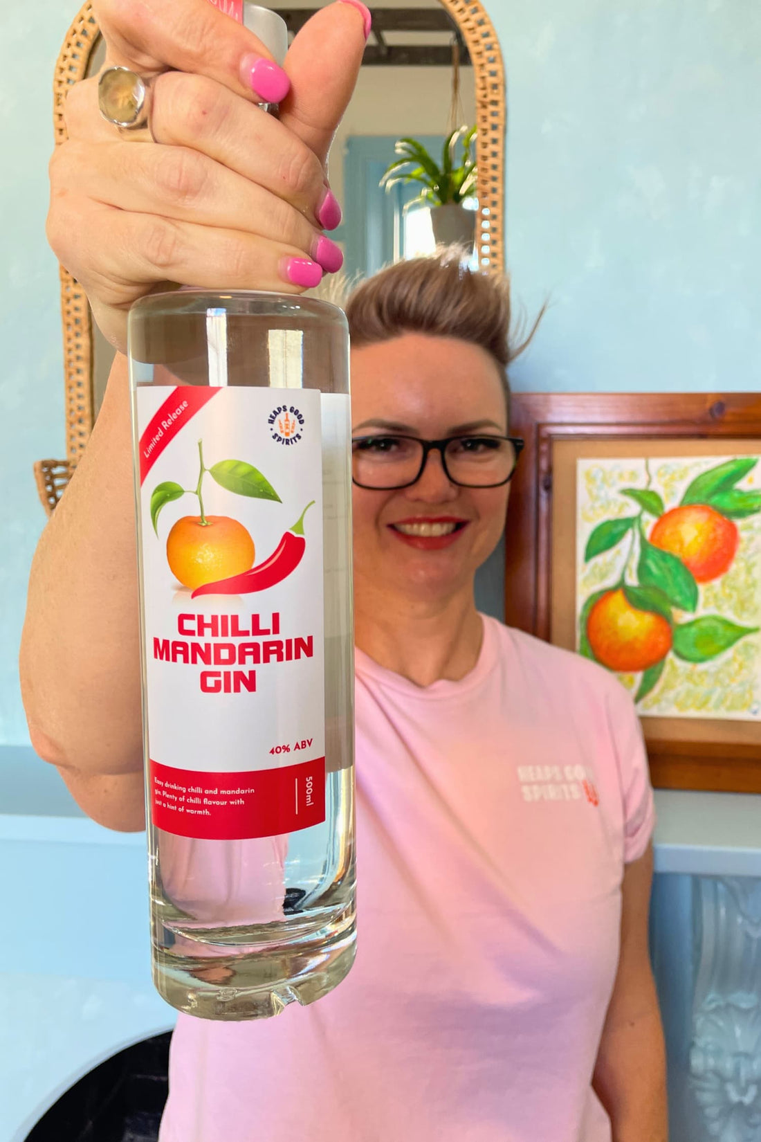 Founder holding Chilli Mandarin Gin bottle by Heaps Good Spirits