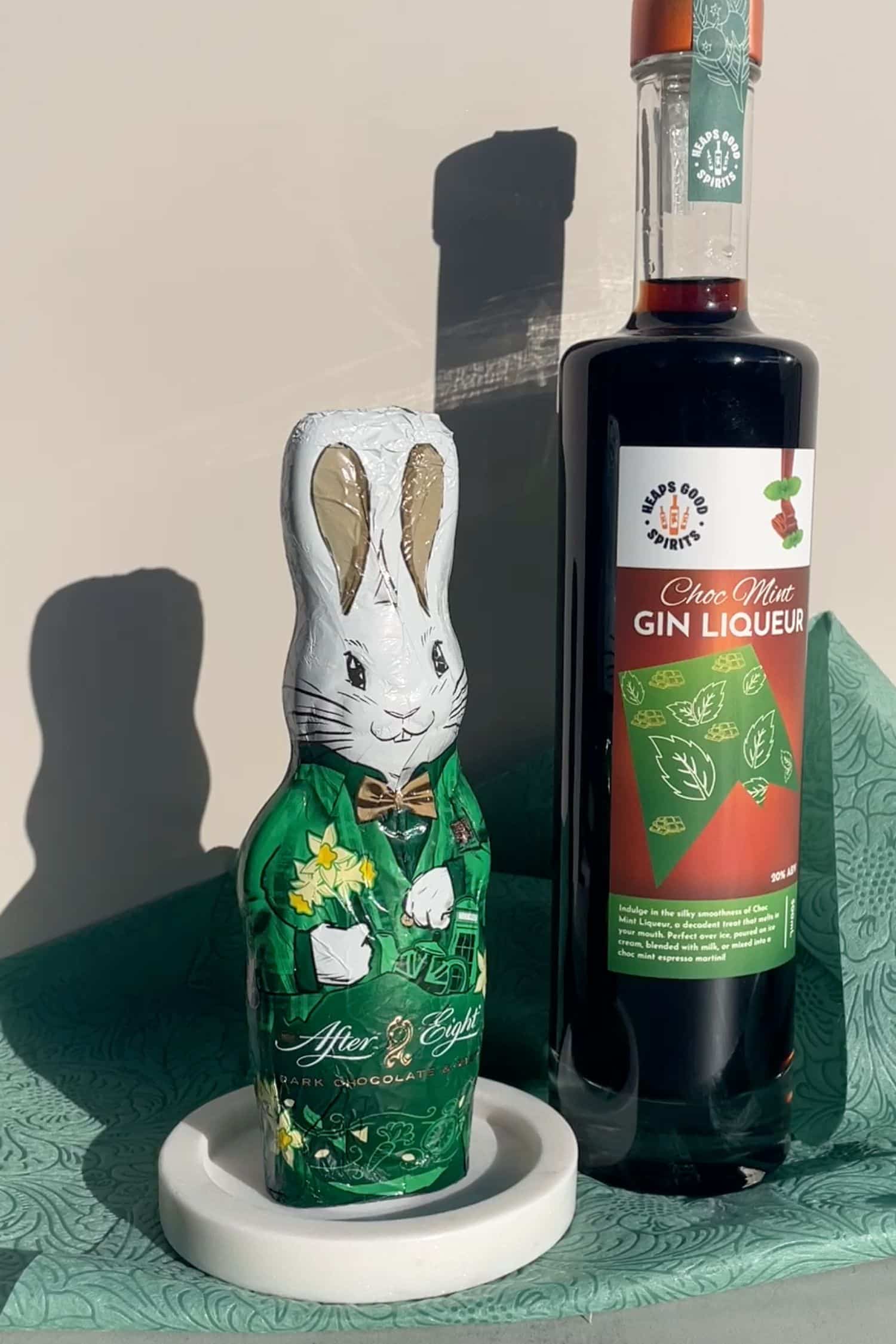 Choc Mint Gin Liqueur bottle with Easter chocolate bunny for choc mint Easter cocktails.
