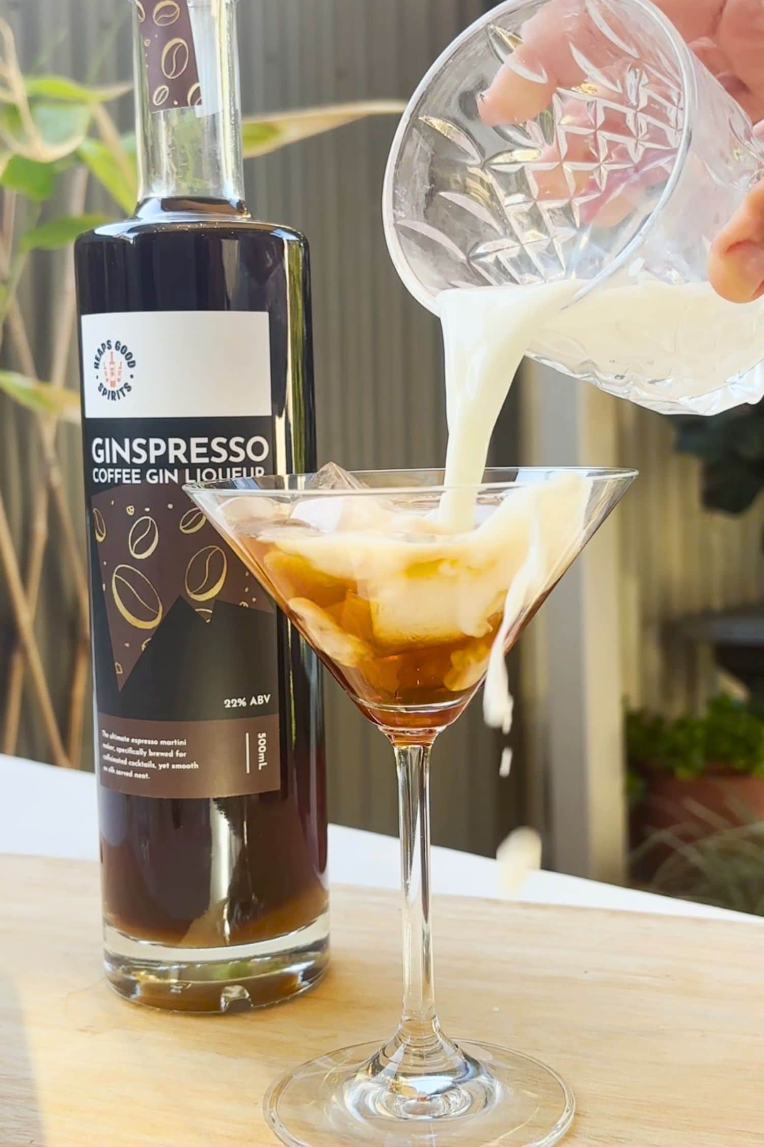 Iced latte coffee cocktail made by pouring milk over Ginspresso coffee gin liqueur by Heaps Good Spirits.