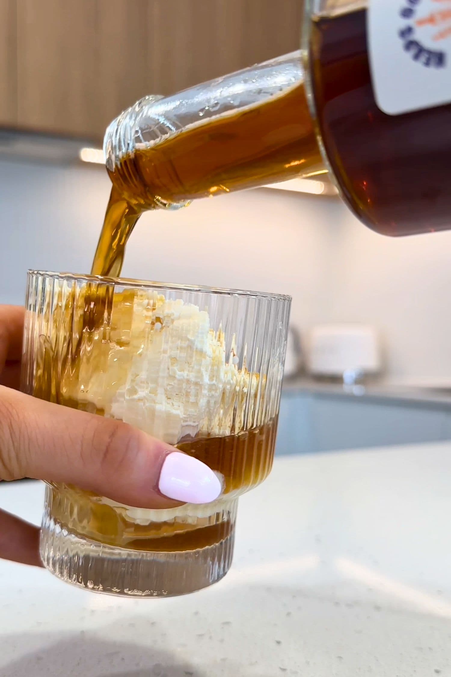 Affogato cocktail dessert made by pouring Ginspresso coffee gin liqueur by Heaps Good Spirits over vanilla ice cream.