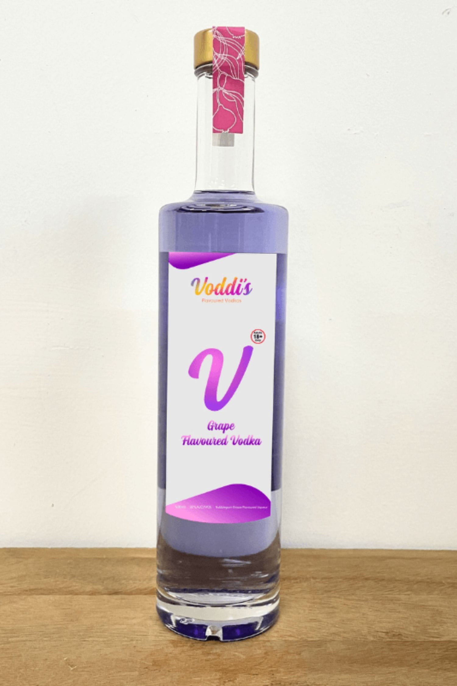 Voddi’s Bubblegum Grape Flavoured Vodka 500ml bottle on wooden surface against white background