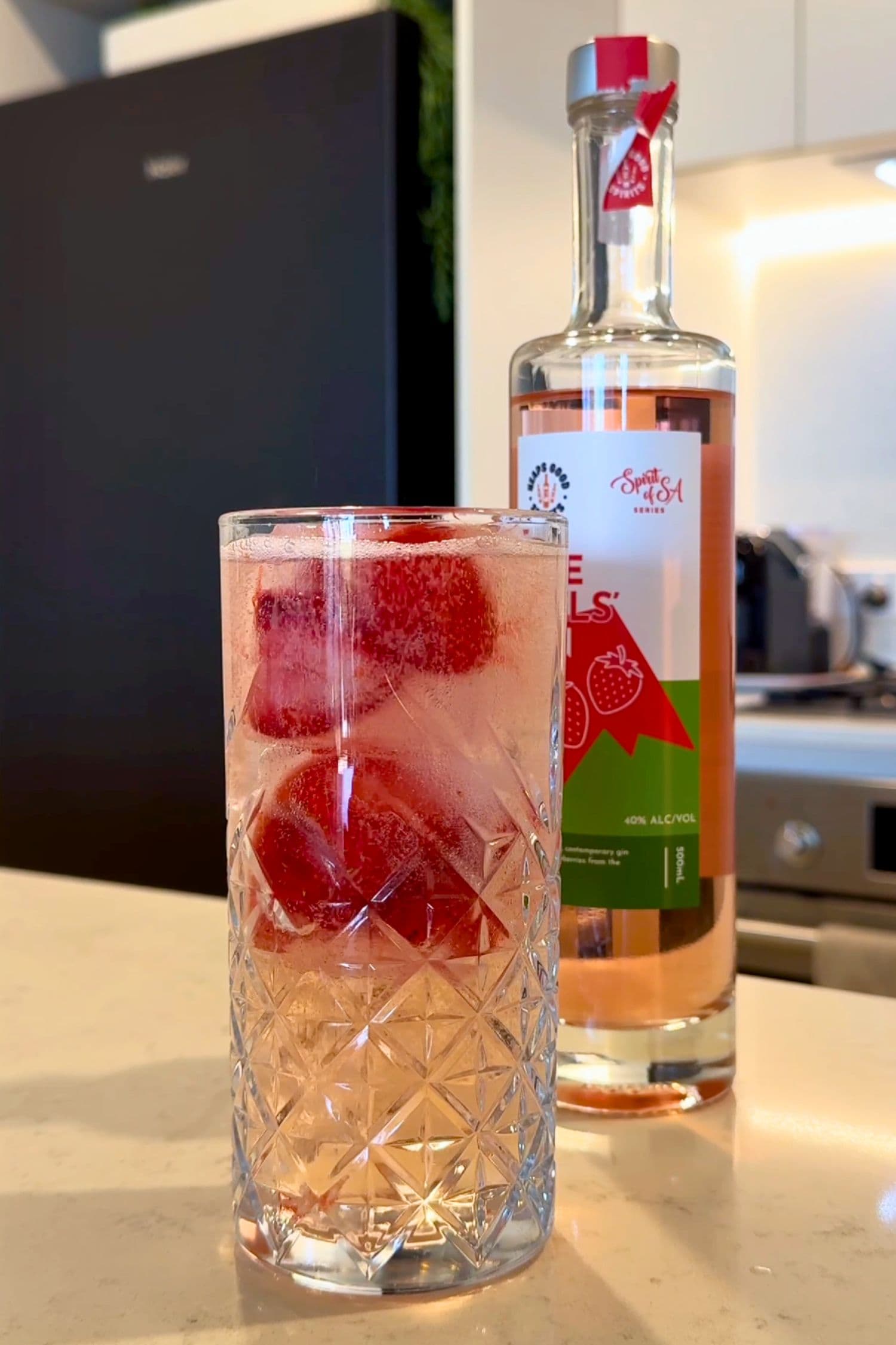 Strawberry gin and soda cocktail made with The Hills Gin and fresh strawberries