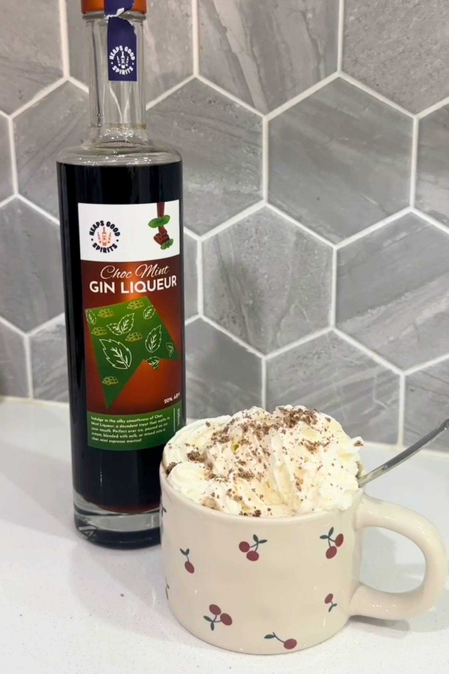 Spiked hot chocolate cocktail garnished with whipped cream, made with Choc Mint Gin Liqueur.