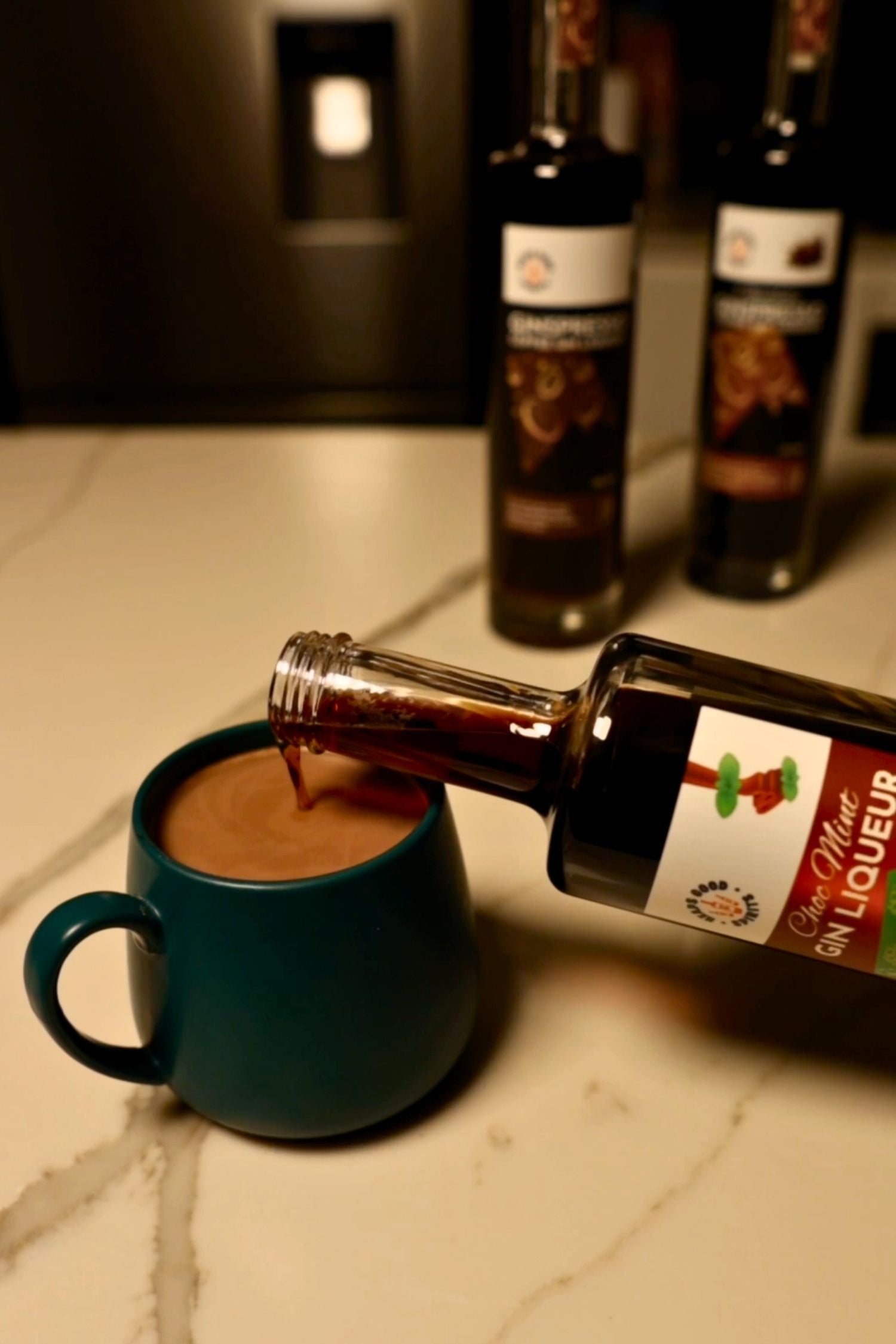 Choc Mint Gin Liqueur being poured into spiked hot chocolate.