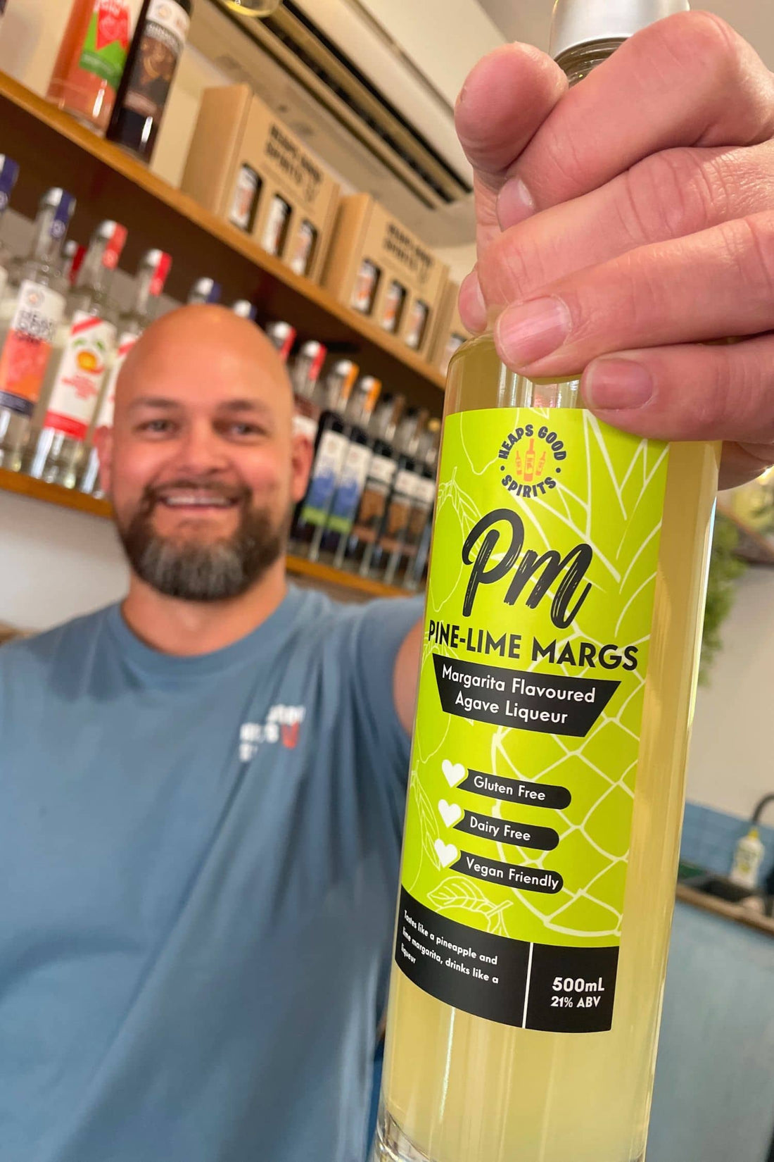 Founder holding Heaps Good Pine-Lime Margs agave liqueur inside Adelaide Hills gin tasting room