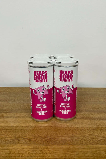 Ready to drink native pink gin and quandong soda 4 pack cans on wooden table.