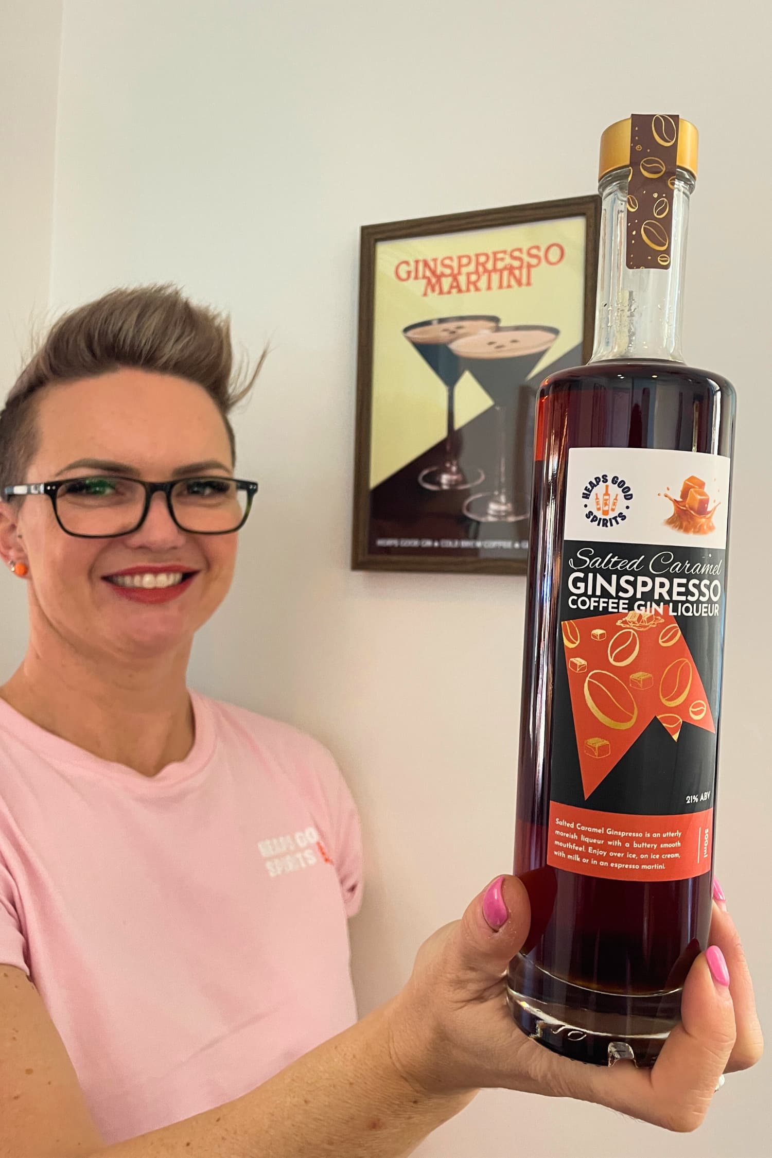 Founder holding Salted Caramel Ginspresso coffee gin liqueur bottle
