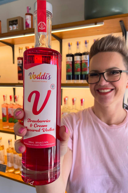 Voddi’s Strawberries &amp; Cream Vodka bottle held in Hahndorf gin shop tasting room.