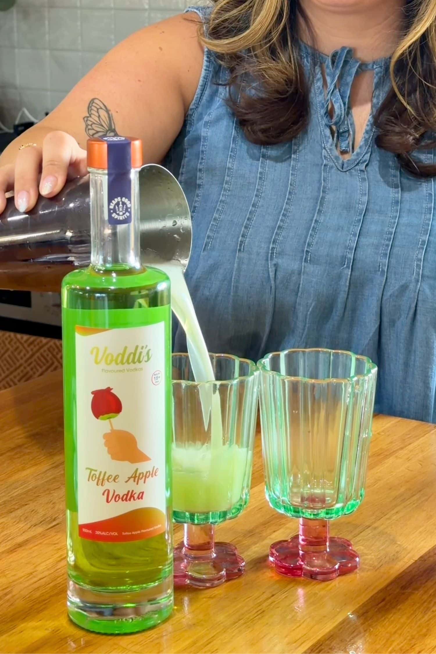 Voddi’s Toffee Apple Vodka being poured into glasses for easy apple vodka cocktail